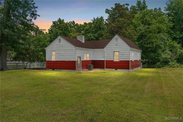 6610 St George St, Chesterfield, VA 23237 - back of property at dusk featuring crawl space and a chimney