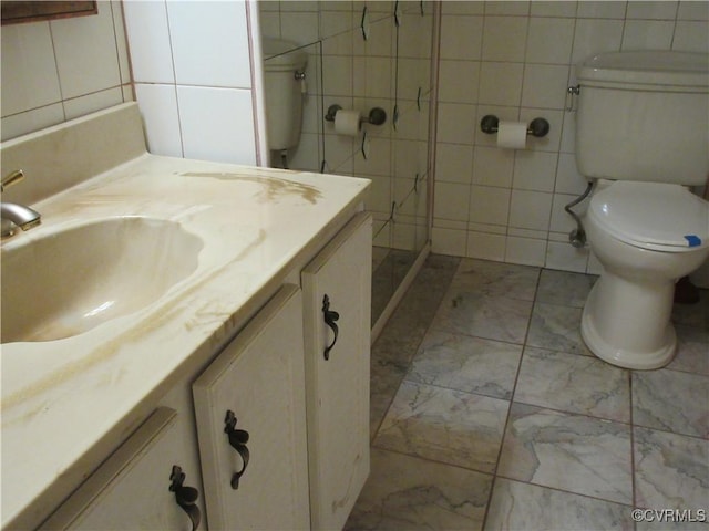 2803 Cannon Rd, Glen Allen, VA 23060 - bathroom featuring tile walls, vanity, and marble look tile flooring