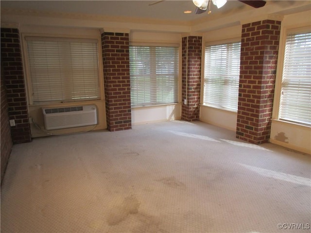 2803 Cannon Rd, Glen Allen, VA 23060 - unfurnished room featuring carpet floors, ceiling fan, a wall mounted air conditioner, and brick wall