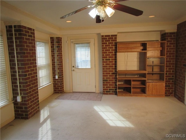 2803 Cannon Rd, Glen Allen, VA 23060 - unfurnished living room with carpet floors, a ceiling fan, and brick wall