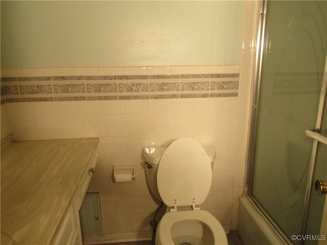 2803 Cannon Rd, Glen Allen, VA 23060 - bathroom with tile walls, enclosed tub / shower combo, wainscoting, and vanity