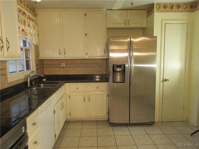 2803 Cannon Rd, Glen Allen, VA 23060 - kitchen with stainless steel appliances, light tile patterned floors, dark countertops, and white cabinets