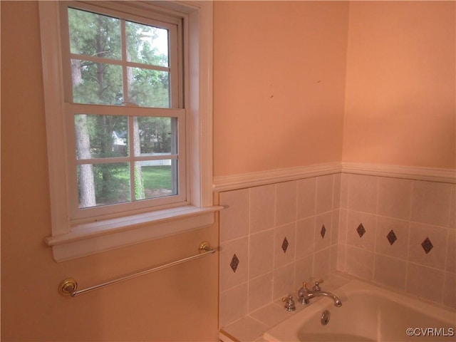 2803 Cannon Rd, Glen Allen, VA 23060 - bathroom featuring a garden tub and a wainscoted wall