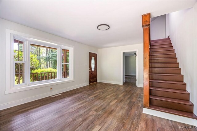 31 Pleasant Run, Cartersville, VA 23027 - foyer entrance with dark wood finished floors and stairway