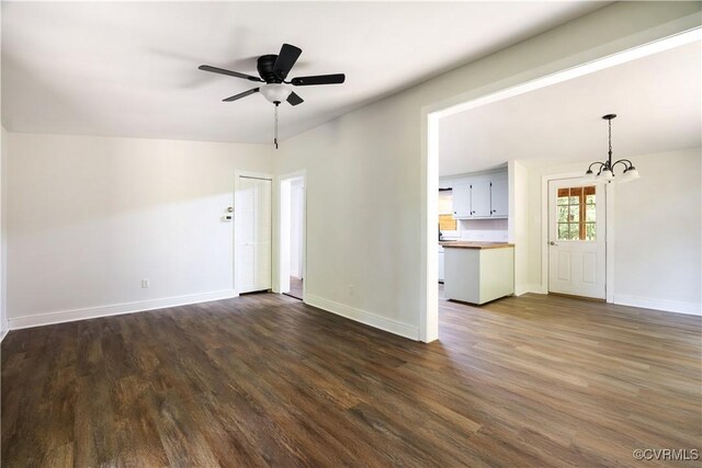 31 Pleasant Run, Cartersville, VA 23027 - unfurnished living room featuring a chandelier, dark wood-type flooring, and a ceiling fan