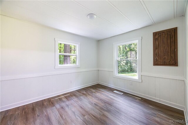 31 Pleasant Run, Cartersville, VA 23027 - unfurnished room featuring wood finished floors, healthy amount of natural light, and a wainscoted wall