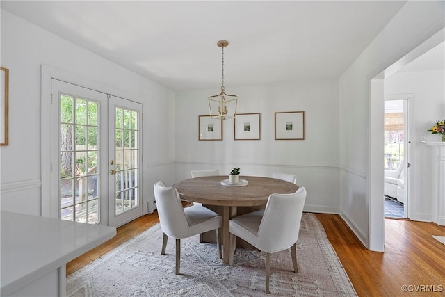 6502 W Franklin St, Henrico, VA 23226 - dining room featuring a chandelier, plenty of natural light, and wood finished floors