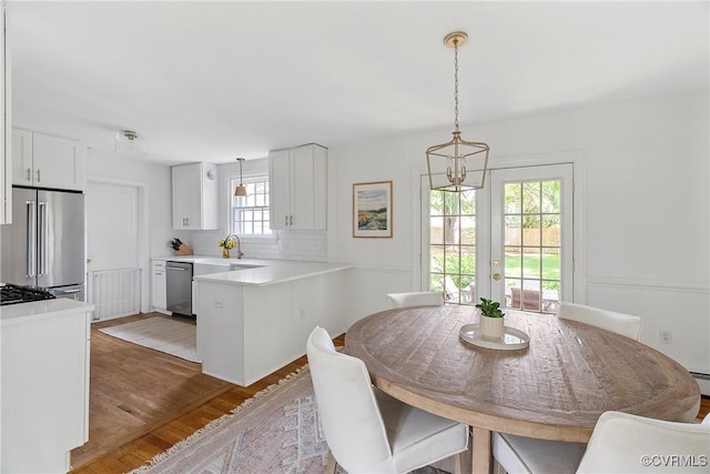 6502 W Franklin St, Henrico, VA 23226 - dining area with wood finished floors and a chandelier