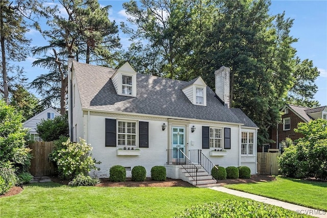 6502 W Franklin St, Henrico, VA 23226 - cape cod house with a chimney, brick siding, and roof with shingles
