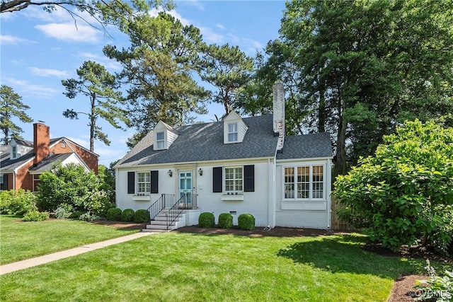 6502 W Franklin St, Henrico, VA 23226 - cape cod-style house with a front yard, a chimney, brick siding, and roof with shingles