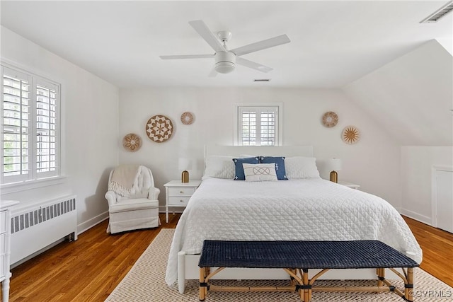 6502 W Franklin St, Henrico, VA 23226 - bedroom with radiator, wood finished floors, ceiling fan, and lofted ceiling