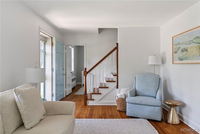 6502 W Franklin St, Henrico, VA 23226 - living room with wood finished floors, stairs, and radiator heating unit