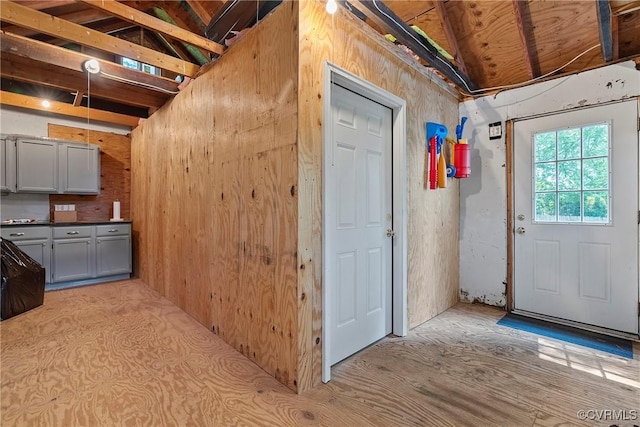 6502 W Franklin St, Henrico, VA 23226 - kitchen featuring gray cabinets, wood walls, and vaulted ceiling