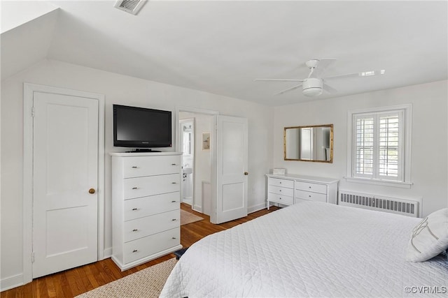 6502 W Franklin St, Henrico, VA 23226 - bedroom with radiator, wood finished floors, and ceiling fan