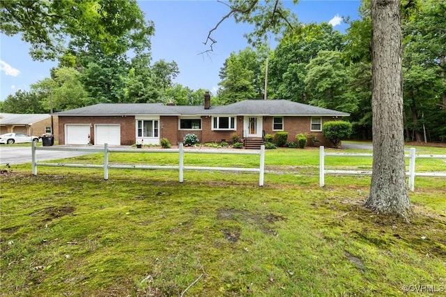 12418 Gravelbrook Rd, South Prince George, VA 23805 - ranch-style house with an attached garage, driveway, a chimney, and brick siding
