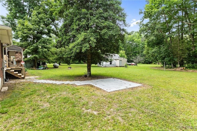 12418 Gravelbrook Rd, South Prince George, VA 23805 - view of green lawn featuring a patio area, stairway, and an outdoor structure