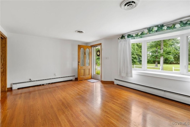 12418 Gravelbrook Rd, South Prince George, VA 23805 - entryway with baseboard heating and light wood finished floors