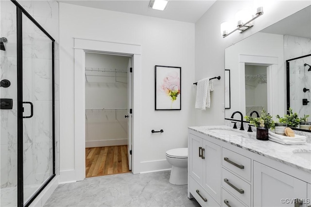 11 W 29th St, Richmond, VA 23225 - bathroom featuring double vanity, a marble finish shower, a spacious closet, and marble finish flooring