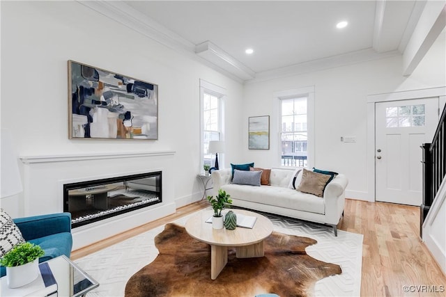 11 W 29th St, Richmond, VA 23225 - living area featuring ornamental molding, healthy amount of natural light, light wood-style floors, a glass covered fireplace, and recessed lighting