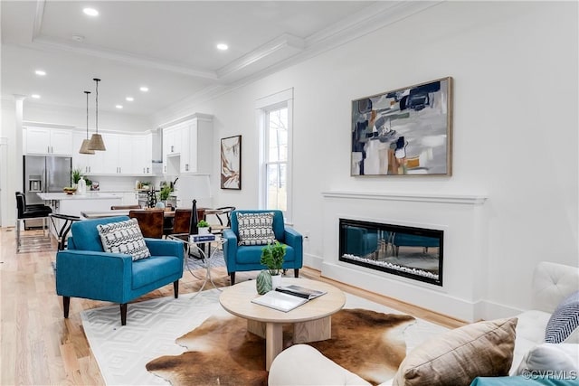11 W 29th St, Richmond, VA 23225 - living area featuring crown molding, light wood-type flooring, recessed lighting, and a glass covered fireplace