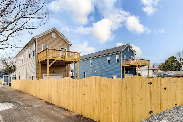 11 W 29th St, Richmond, VA 23225 - back of house with a balcony and a gate