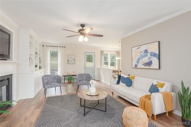 206 Michaux Crossing Ln, Chesterfield, VA 23113 - living room with light wood-style flooring, a glass covered fireplace, ceiling fan, and ornamental molding
