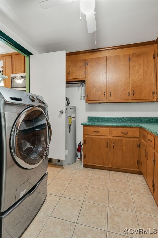 1948 Neptune Dr, North Chesterfield, VA 23235 - laundry room featuring cabinet space, washer / dryer, water heater, a ceiling fan, and light tile patterned floors