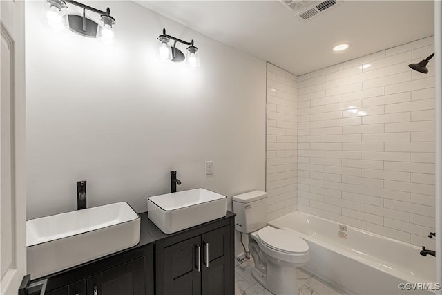 833 Wilcox St, Petersburg, VA 23803 - bathroom with marble look tiles, double vanity, shower / washtub combination, and recessed lighting