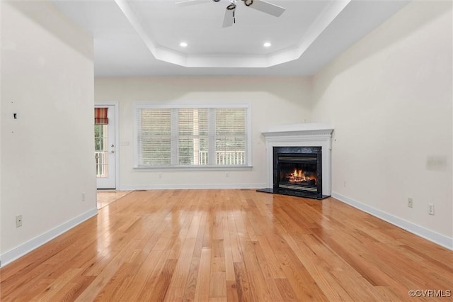 13531 Butlers Rd, Amelia Courthouse, VA 23002 - unfurnished living room with plenty of natural light, a tray ceiling, light wood-style flooring, a ceiling fan, and recessed lighting