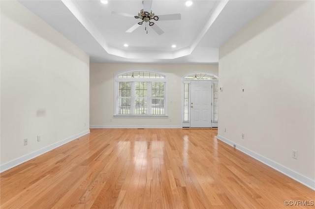 13531 Butlers Rd, Amelia Courthouse, VA 23002 - unfurnished living room featuring recessed lighting, light wood-style flooring, ceiling fan, and a tray ceiling