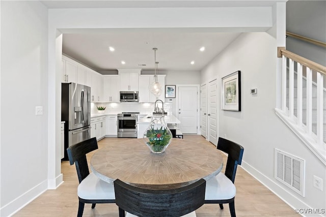13210 Garland Ln, Midlothian, VA 23114 - dining room with light wood-style floors, stairs, and recessed lighting