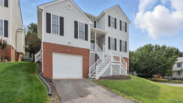 500 Village Gate Dr, Midlothian, VA 23114 - view of front of house with brick siding, an attached garage, a front lawn, and stairway