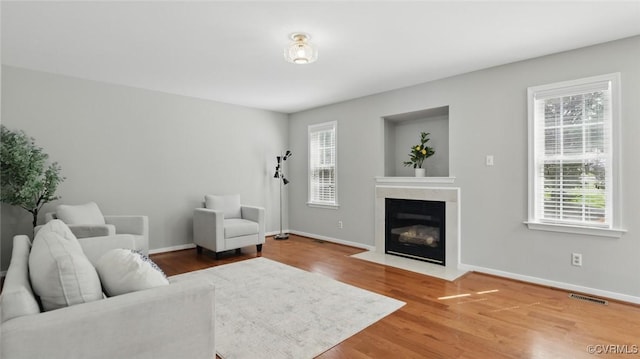 500 Village Gate Dr, Midlothian, VA 23114 - living room featuring a fireplace with flush hearth and wood finished floors