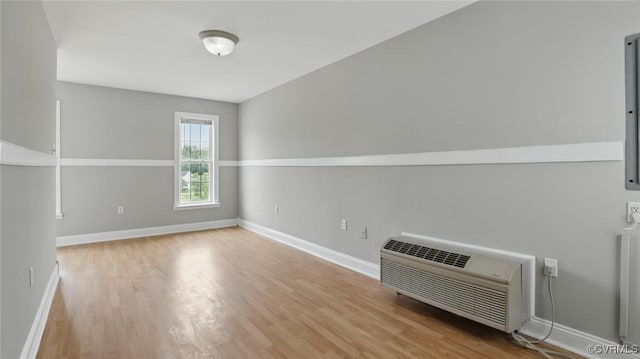 500 Village Gate Dr, Midlothian, VA 23114 - unfurnished room featuring wood finished floors and a wall mounted air conditioner