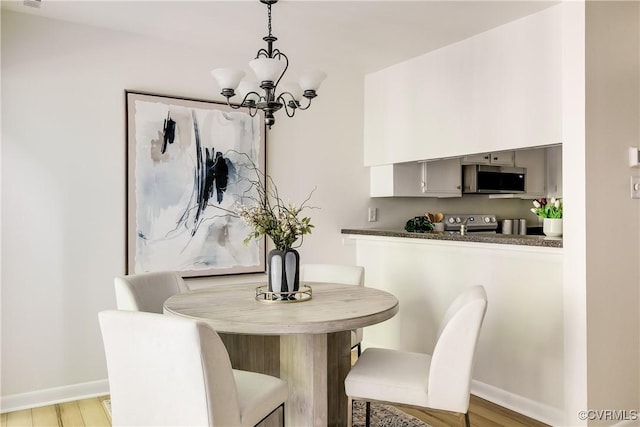 4814 Long Shadow Dr, Chesterfield, VA 23112 - dining space with a chandelier and light wood-style flooring