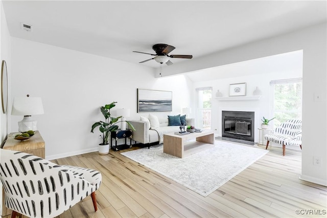 4814 Long Shadow Dr, Chesterfield, VA 23112 - living area featuring a ceiling fan, healthy amount of natural light, light wood finished floors, and a glass covered fireplace