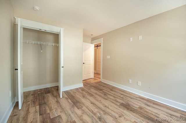 117 Meeting Pl, Williamsburg, VA 23185 - unfurnished bedroom with wood finished floors and a closet