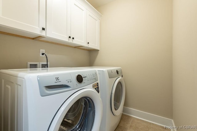 117 Meeting Pl, Williamsburg, VA 23185 - laundry area featuring cabinet space, washing machine and dryer, and light tile patterned floors