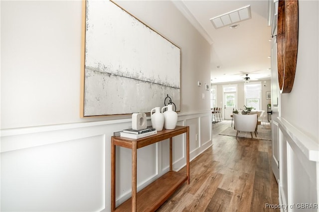 117 Meeting Pl, Williamsburg, VA 23185 - hallway featuring a decorative wall, wood finished floors, a wainscoted wall, and recessed lighting