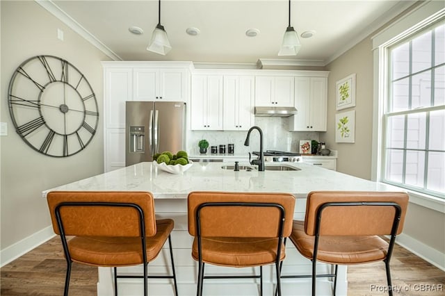 117 Meeting Pl, Williamsburg, VA 23185 - kitchen featuring stainless steel fridge with ice dispenser, under cabinet range hood, crown molding, wood finished floors, and white cabinets