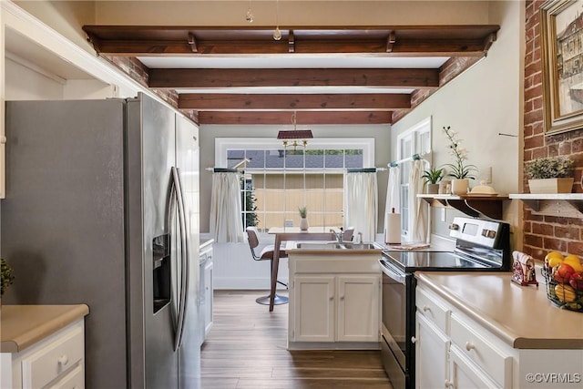 429 4th St, West Point, VA 23181 - kitchen featuring appliances with stainless steel finishes, dark wood-style flooring, white cabinetry, beamed ceiling, and light countertops