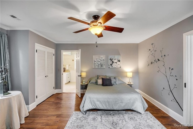 429 4th St, West Point, VA 23181 - bedroom featuring wood finished floors, crown molding, a closet, and a ceiling fan