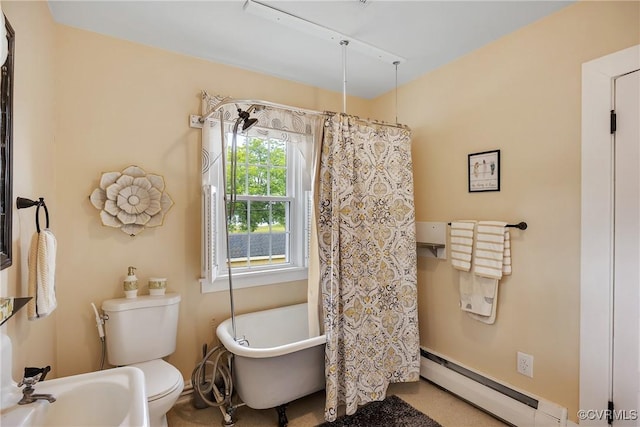 429 4th St, West Point, VA 23181 - full bathroom featuring baseboard heating and a soaking tub