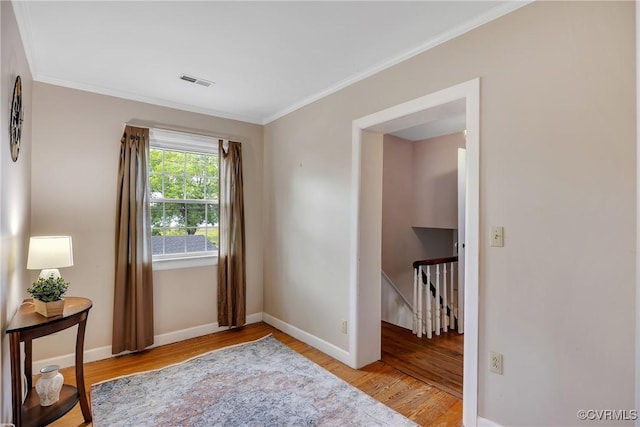 429 4th St, West Point, VA 23181 - sitting room with an upstairs landing, light wood-type flooring, and ornamental molding