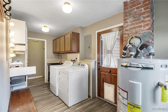 429 4th St, West Point, VA 23181 - washroom featuring cabinet space, electric water heater, washing machine and dryer, light wood-style floors, and electric panel