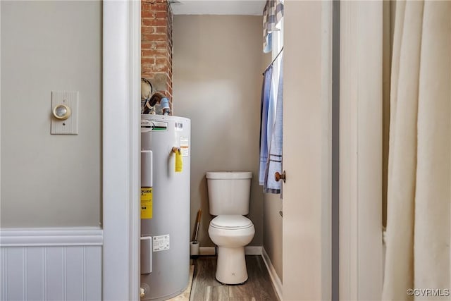 429 4th St, West Point, VA 23181 - bathroom with electric water heater and wood finished floors