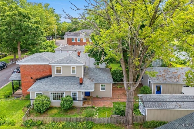429 4th St, West Point, VA 23181 - view of front facade featuring a fenced front yard and roof with shingles