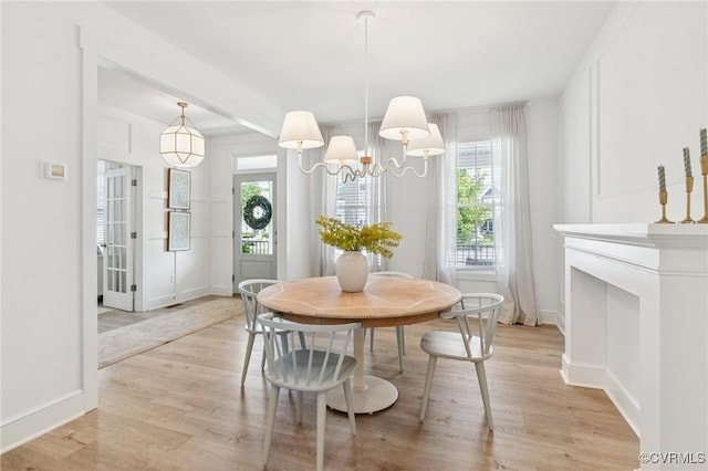 18207 Maple Summit Ct, Moseley, VA 23120 - dining room with healthy amount of natural light, light wood-type flooring, and a chandelier
