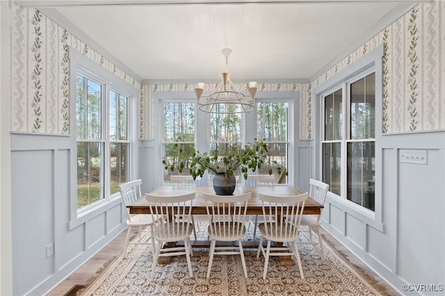 18207 Maple Summit Ct, Moseley, VA 23120 - sunroom / solarium featuring a chandelier, wood finished floors, wallpapered walls, and a decorative wall