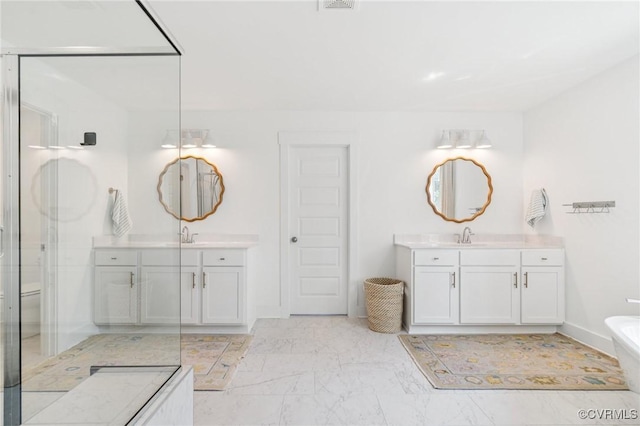 18207 Maple Summit Ct, Moseley, VA 23120 - full bathroom featuring two vanities, a soaking tub, a stall shower, and marble finish flooring